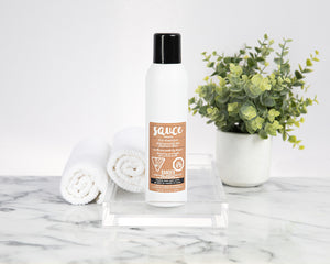 Sauce Beauty Vanilla Cocoa Powder Dry Shampoo Bottle In Bathroom